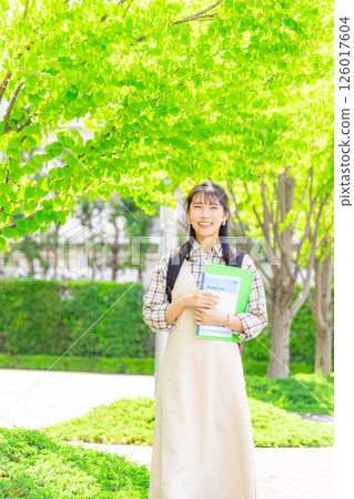 College student woman walking outside 126017604