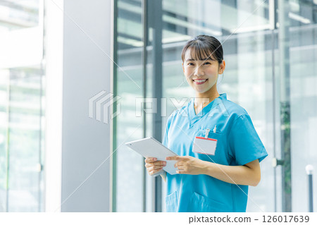 Smiling young female doctor 126017639