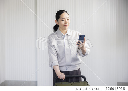 Middle-aged woman wearing work clothes Middle-aged woman wearing work clothes 126018018
