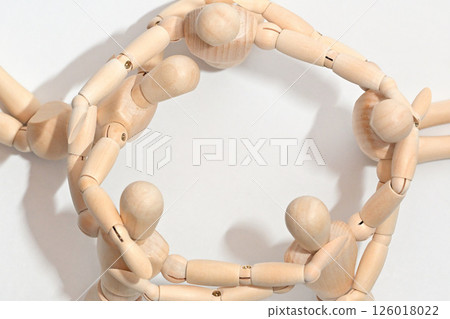 Image of people standing in a circle, arms together, confirming unity. Image of people standing in a circle, arms together, confirming unity. 126018022