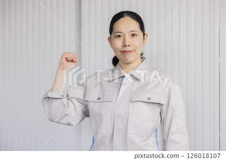 Middle-aged woman wearing work clothes 126018107
