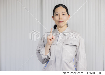 Middle-aged woman wearing work clothes 126018109