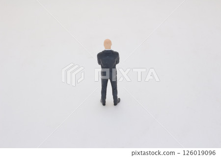 Miniature Figurine of Businessman in Suit on Clean White Background 126019096