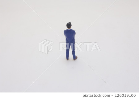 Miniature Figurine of Businessman in Suit on Clean White Background 126019100