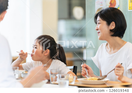 Family eating at a restaurant Family eating at a restaurant 126019348