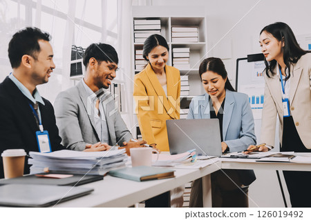 Team of financial advisory services. Asian advisor showing plan of investment to clients in the consultancy office. Team of financial advisory services. Asian advisor showing plan of investment to clients in the consultancy office. 126019492