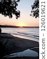 Sunset time on the beach 126019621