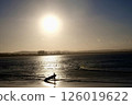 Sunset and surfers 126019622