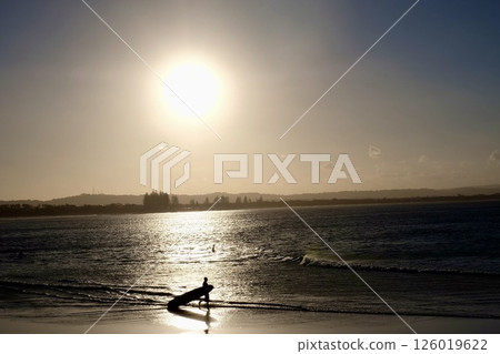 Sunset and surfers 126019622