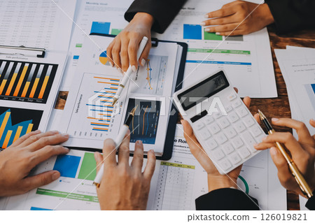 Business financing accounting banking concept. Business woman hand doing finances and calculate on desk about cost at home office. Woman working on desk with using calculator, finance accounting. 126019821