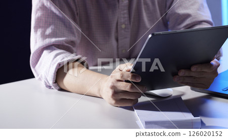 People working together and sharing ideas in a modern business environment. 126020152