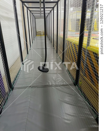 Padded Trampoline Park Corridor with Safety Netting and Pendulum Device Padded Trampoline Park Corridor with Safety Netting and Pendulum Device 126021257