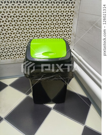 Modern Waste Bin with Lime Green Lid in Geometric Interior Setting Modern Waste Bin with Lime Green Lid in Geometric Interior Setting 126021314