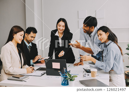 Team of financial advisory services. Asian advisor showing plan of investment to clients in the consultancy office. Team of financial advisory services. Asian advisor showing plan of investment to clients in the consultancy office. 126021497