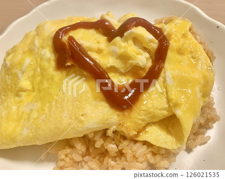 Stock Photo: Omelet rice served with heart-shaped ketchup 126021535