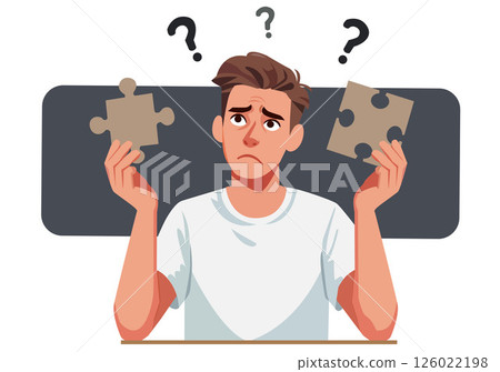 A man is confused about putting together a jigsaw puzzle. A man is confused about putting together a jigsaw puzzle. 126022198