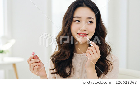 Photo-style material: Woman applying lip gloss 126022368