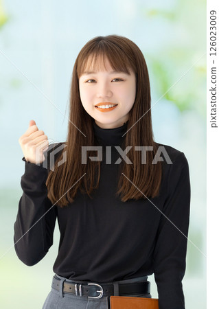 Woman/businesswoman doing a fist pump Woman/businesswoman doing a fist pump 126023009