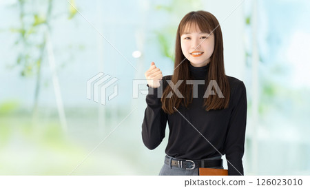 Woman/businesswoman doing a fist pump Woman/businesswoman doing a fist pump 126023010