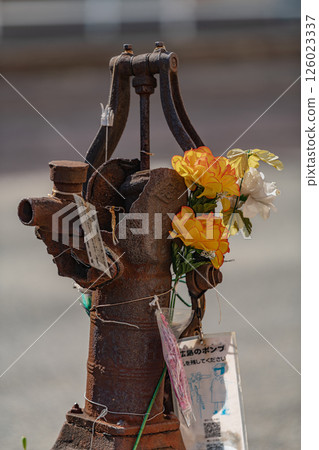 The bomb-damaged pump near the Hiroshima Electric Railway Enkobashi tram stop 126023337