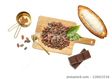 Cacao beans, chocolate bars, and preparation tools arranged on a cutting board ready for use, isolated on white, PNG Cacao beans, chocolate bars, and preparation tools arranged on a cutting board ready for use, isolated on white, PNG 126023516