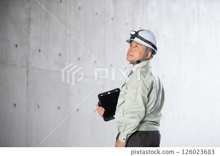 A management company employee patrolling the basement of the facility 126023683