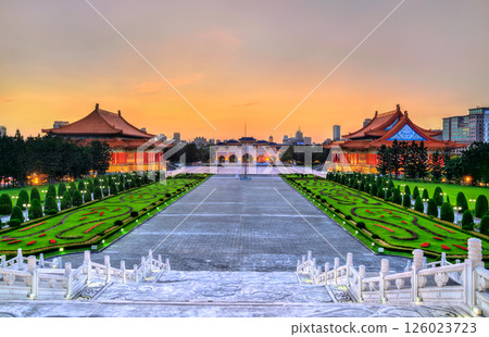 Liberty Square in Taipei, Taiwan, viewed at sunset with the National Theater and National Concert Hall flanking the grand plaza, showcasing traditional Chinese architecture and elegant gardens in a Liberty Square in Taipei, Taiwan, viewed at sunset with the National Theater and National Concert Hall flanking the grand plaza, showcasing traditional Chinese architecture and elegant gardens in a 126023723