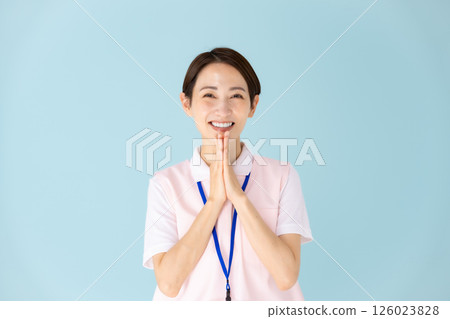 Woman in apron, caregiver, nursery teacher, medical, happy 126023828