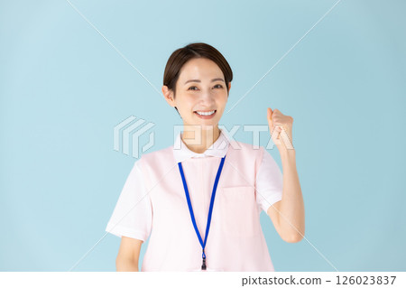 Apron woman, caregiver, nursery teacher, medical, fist pump Apron woman, caregiver, nursery teacher, medical, fist pump 126023837