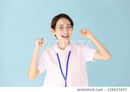 Apron woman, caregiver, nursery teacher, medical, fist pump Apron woman, caregiver, nursery teacher, medical, fist pump 126023847