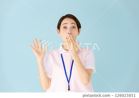 Woman in apron, caregiver, nursery teacher, medical, surprised Woman in apron, caregiver, nursery teacher, medical, surprised 126023851