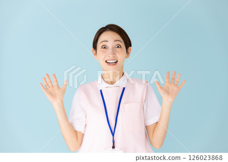 Woman in apron, caregiver, nursery teacher, medical, surprised 126023868