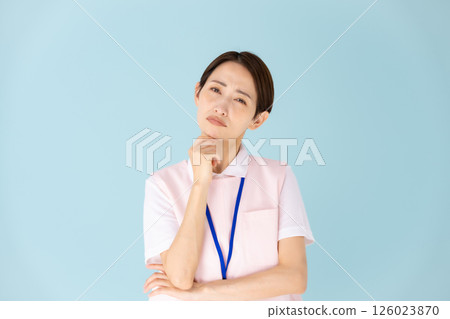 Woman in apron, caregiver, nursery teacher, medical, worries 126023870