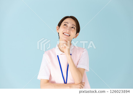 Woman in apron, caregiver, nursery teacher, medical, planning Woman in apron, caregiver, nursery teacher, medical, planning 126023894