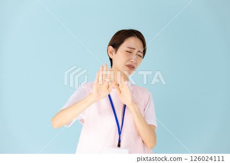 Woman in apron, caregiver, nursery teacher, medical, not allowed Woman in apron, caregiver, nursery teacher, medical, not allowed 126024111