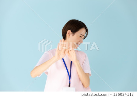 Woman in apron, caregiver, nursery teacher, medical, not allowed Woman in apron, caregiver, nursery teacher, medical, not allowed 126024112