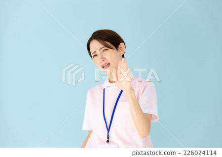 Woman in apron, caregiver, nursery teacher, medical, not allowed Woman in apron, caregiver, nursery teacher, medical, not allowed 126024114