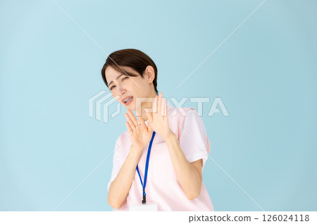 Woman in apron, caregiver, nursery teacher, medical, not allowed 126024118