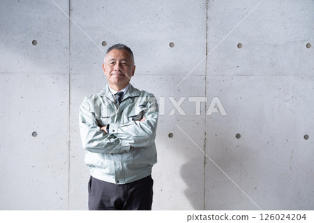 A veteran man standing tall and confidently supporting a construction site A veteran man standing tall and confidently supporting a construction site 126024204