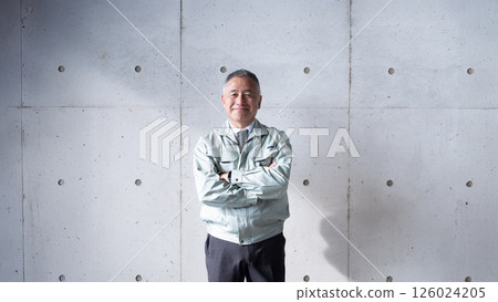 A veteran man standing tall and confidently supporting a construction site A veteran man standing tall and confidently supporting a construction site 126024205