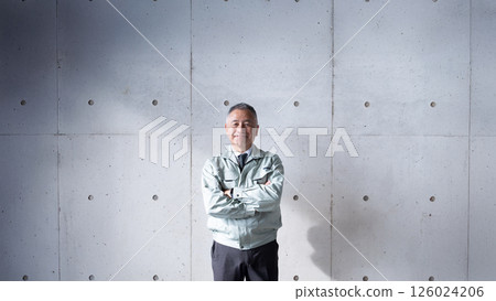 A veteran man standing tall and confidently supporting a construction site A veteran man standing tall and confidently supporting a construction site 126024206
