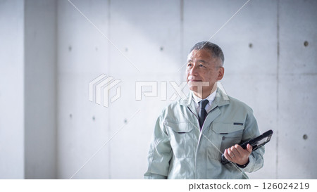 A veteran man standing tall and confidently supporting a construction site A veteran man standing tall and confidently supporting a construction site 126024219