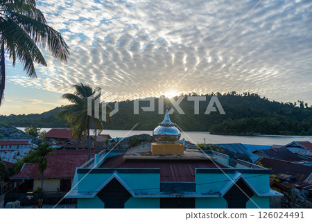 Sunset over Pulau Papan mosque and village, Malenge, Sulawesi, Indonesia Sunset over Pulau Papan mosque and village, Malenge, Sulawesi, Indonesia 126024491