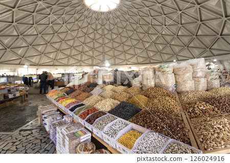 hawker sell the dried fruit and nut in the market Siyob bazaar or so called Slab bazaar is the biggest bazaar in Samarkand. 126024916