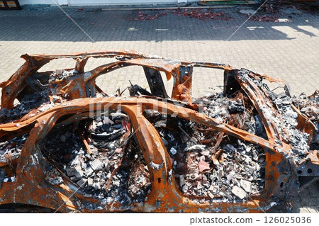 A car is on fire and has been destroyed A car is on fire and has been destroyed 126025036