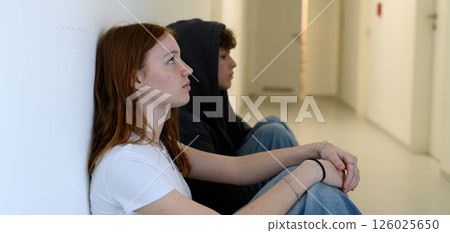 Boy and girl waiting in hospital waiting room for medical examination. 126025650