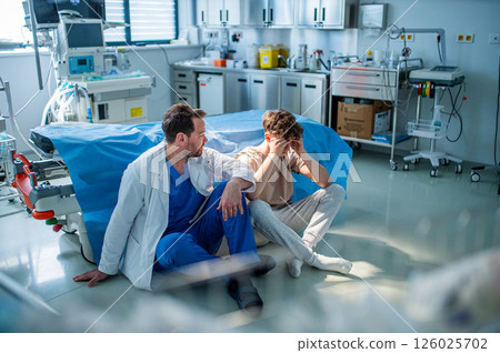 Teenager confiding in doctor about personal and health problems. 126025702