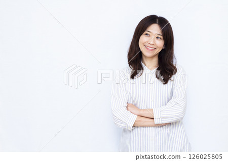 Woman thinking with a smile 126025805