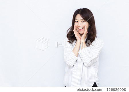 A woman calling out with a smile 126026008