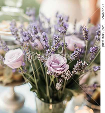 Outdoor wedding buffet table with lavender and a variety of dishes. 126026377
